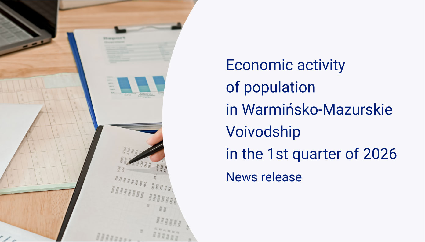 Slider whit people are analyzing statistical data at a desk, Publication Economic activity of population in Warmińsko-Mazurskie Voivodship in the 1st quarter of 2026